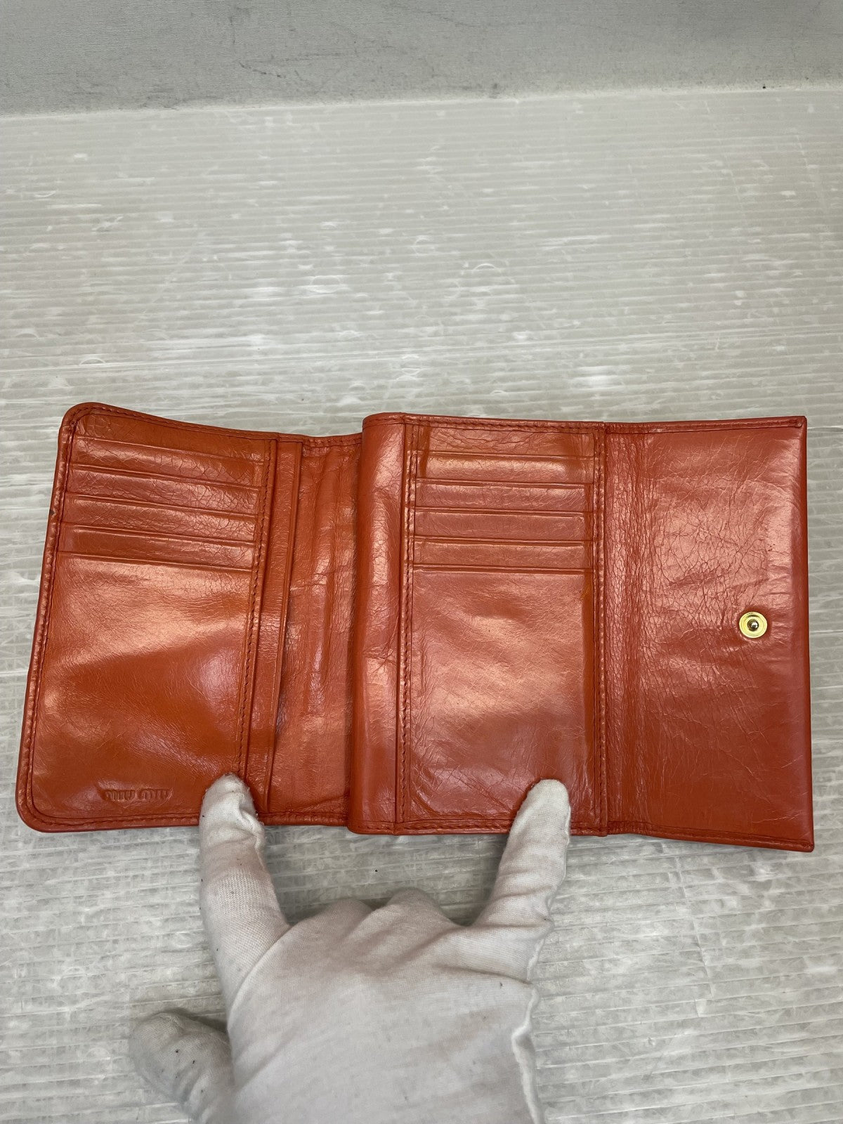 miumiu マテラッセ コンパクトウォレット オレンジ