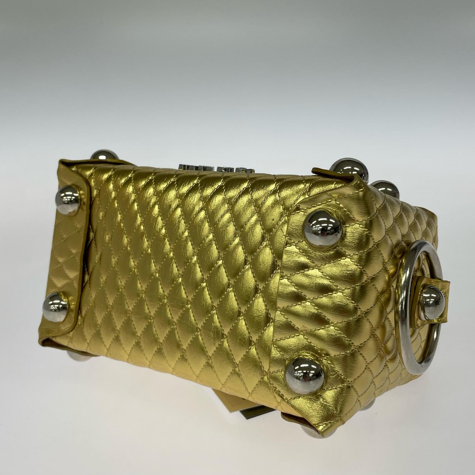 その他バッグ LEATHER CAKE BAG GOLD ゴールド