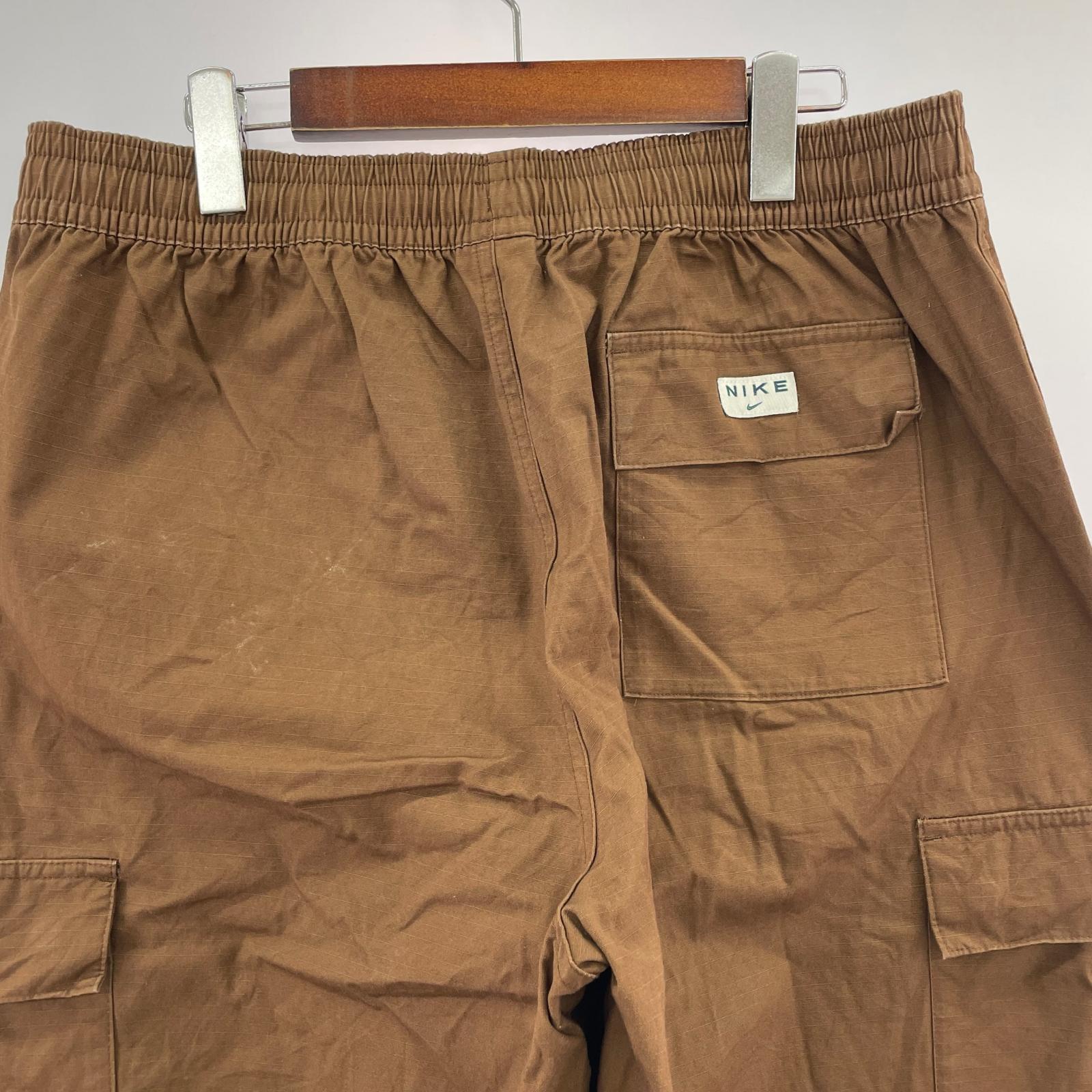 パンツ AS M NK CARGO WVN PANT ブラウン