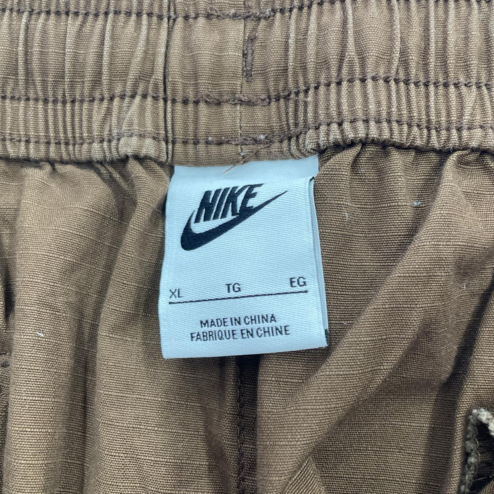 パンツ AS M NK CARGO WVN PANT ブラウン