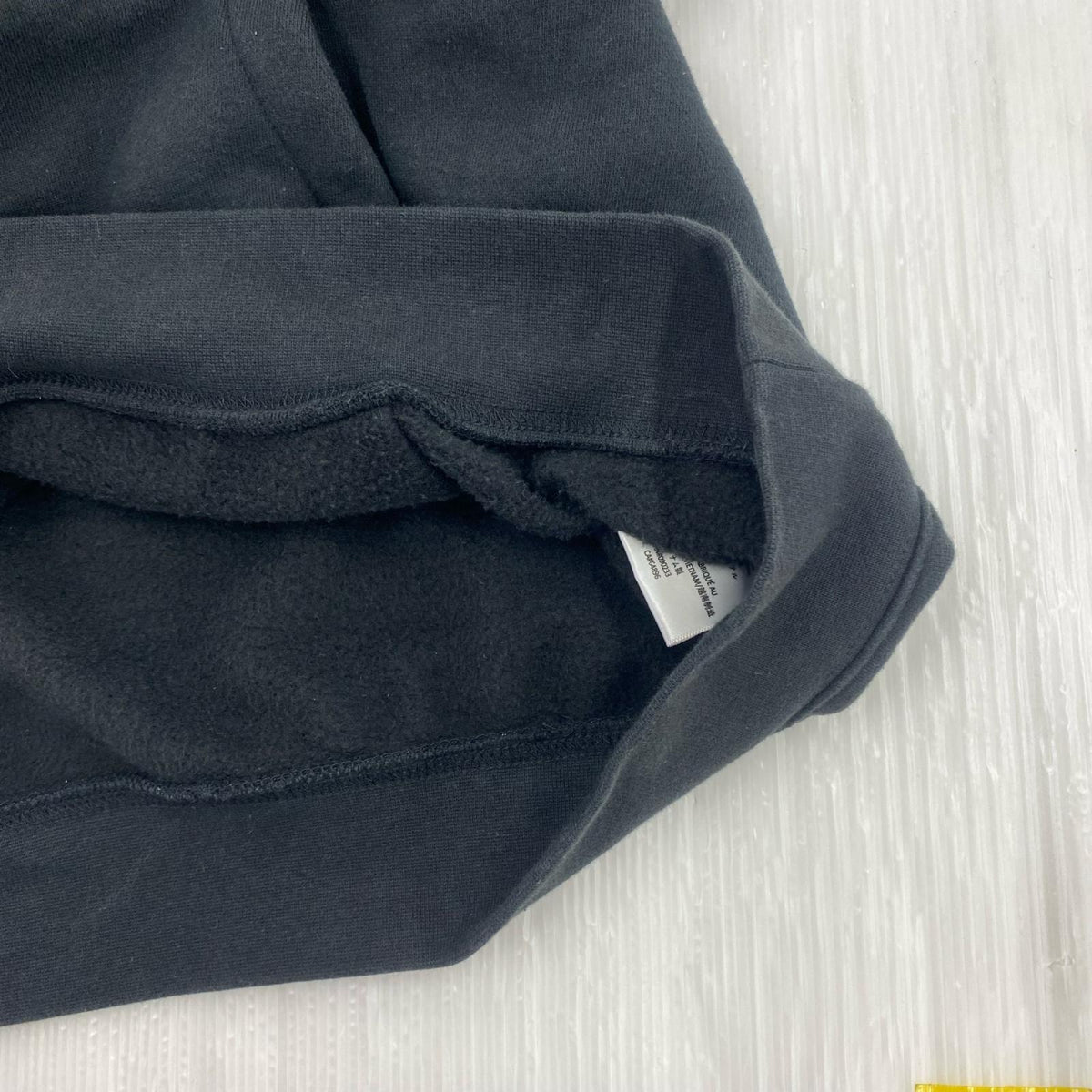 パーカー ESSENTIALS FEAR OF GOD フロッキープリントスウェット S ブラック