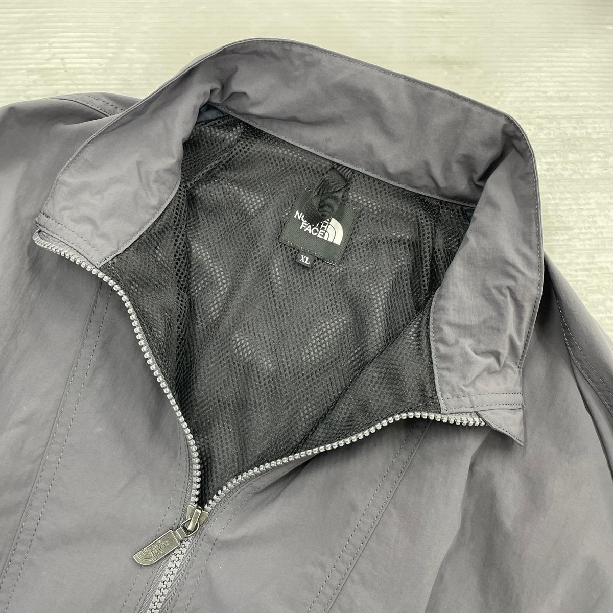 ジャケット ENRIDE TRACK JACKET グレー (XL) NP22560 LL グレー