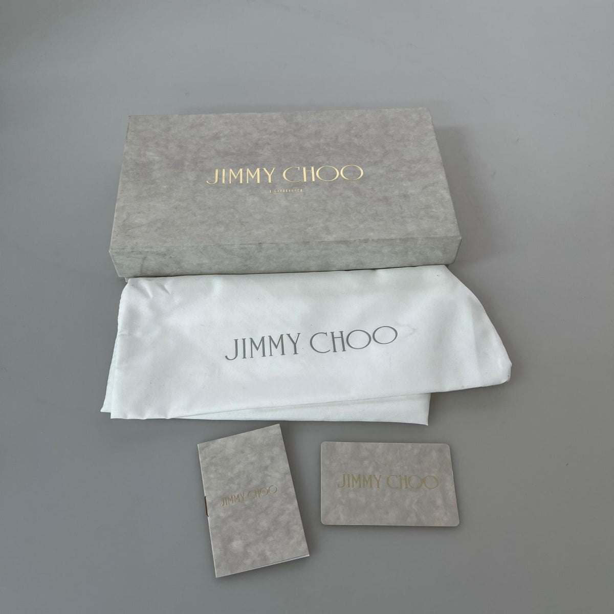 JIMMY CHOO/スターズタッズラインストーンラウンドジップ