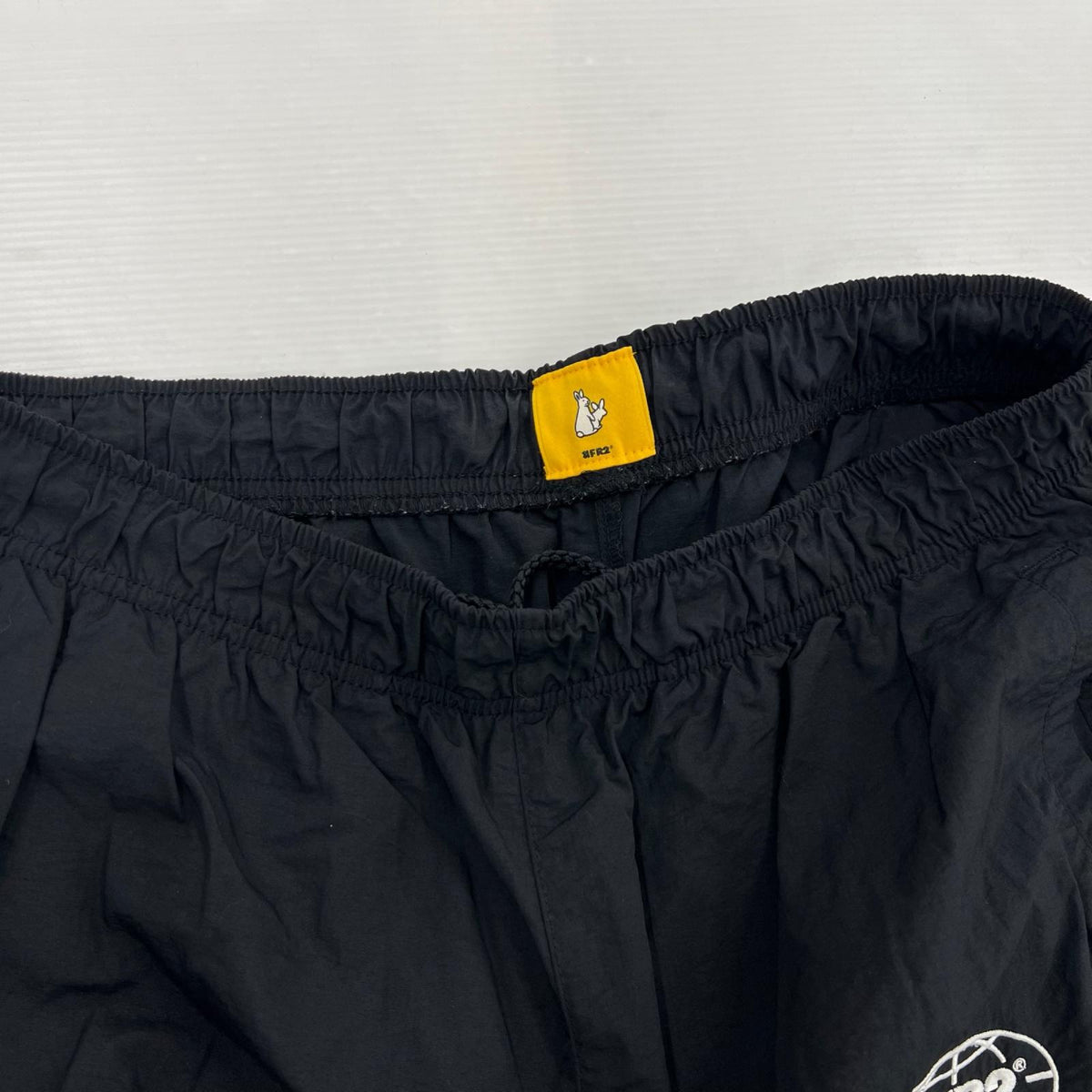 パンツ EARTH LOGO ナイロンパンツ BLK L ブラック