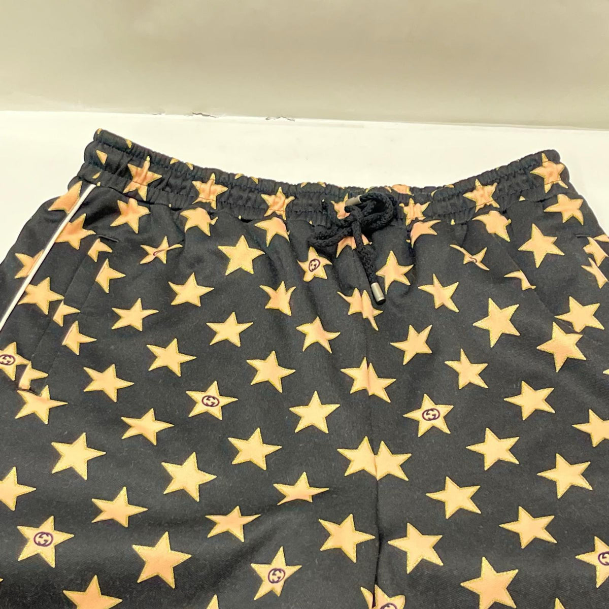 GUCCI/Technical jersey shorts with stars M 705299