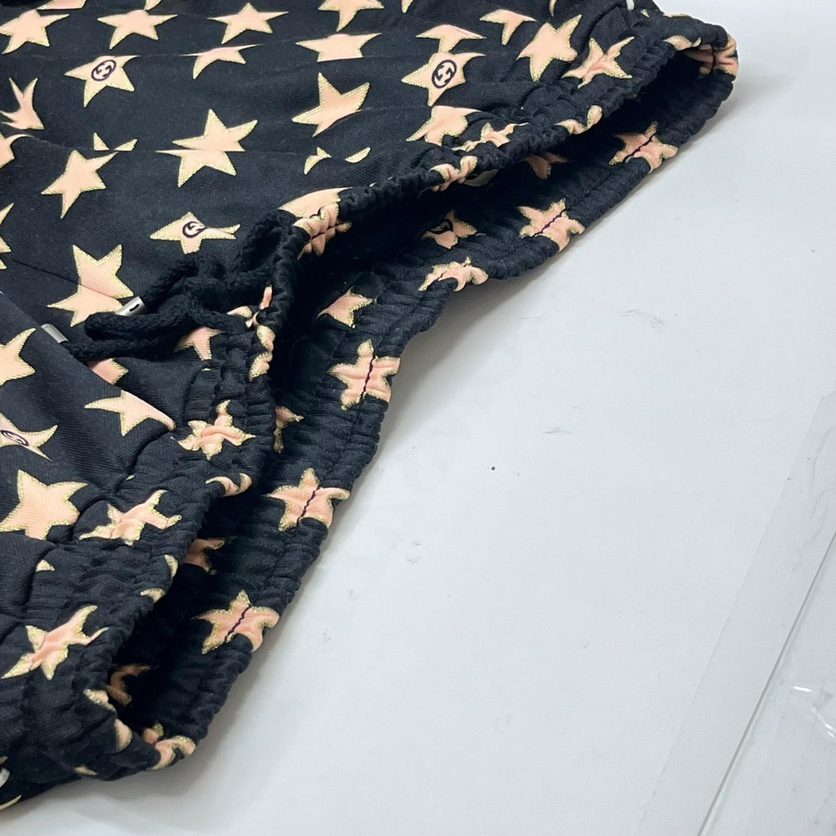 GUCCI/Technical jersey shorts with stars M 705299