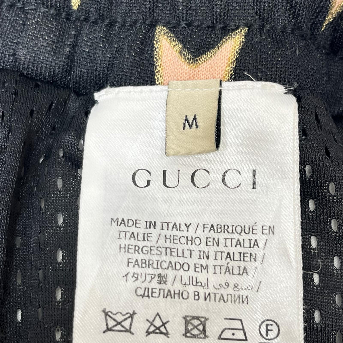 GUCCI/Technical jersey shorts with stars M 705299
