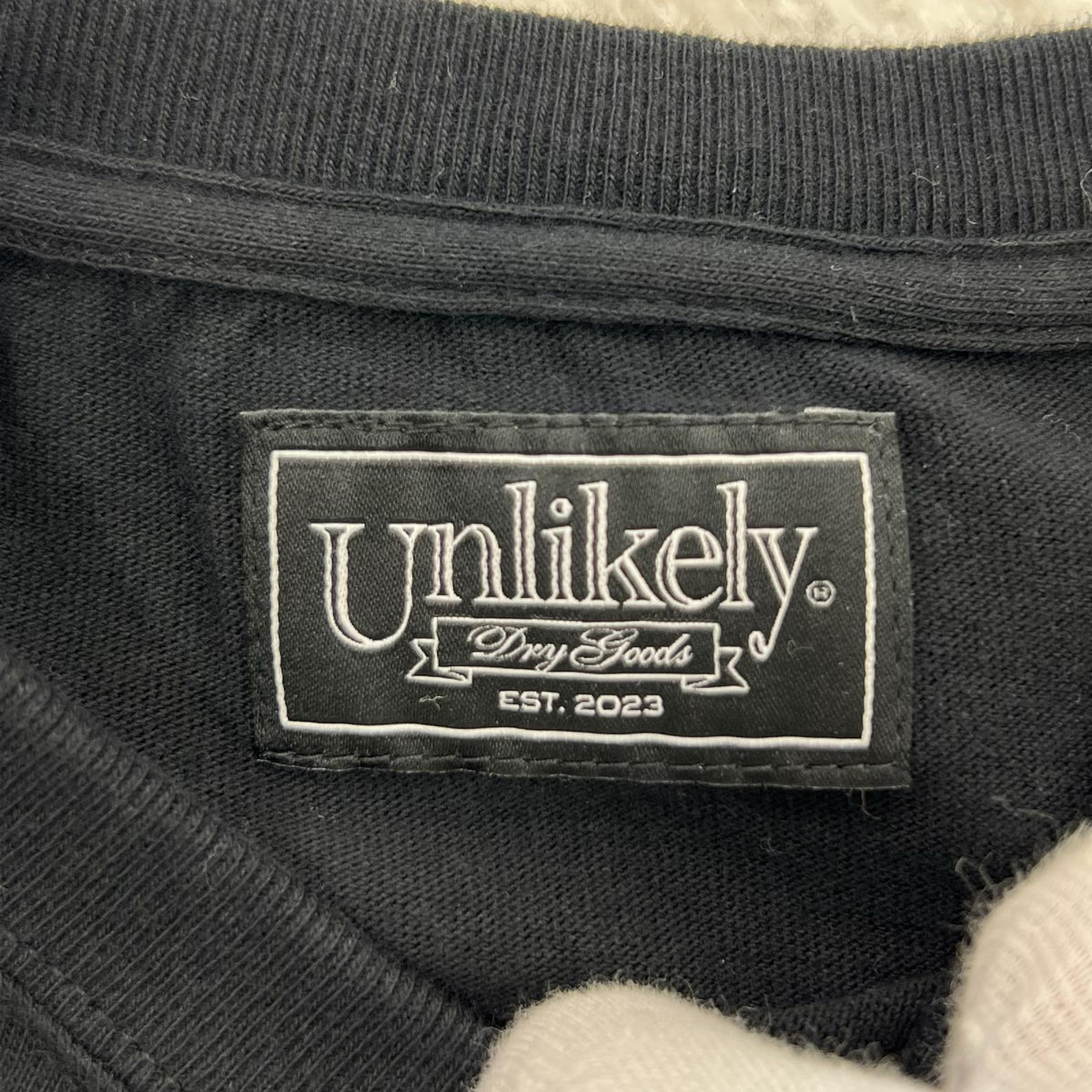 長袖Tシャツ unlikely NEPENTHES ロンT黒 M ブラック