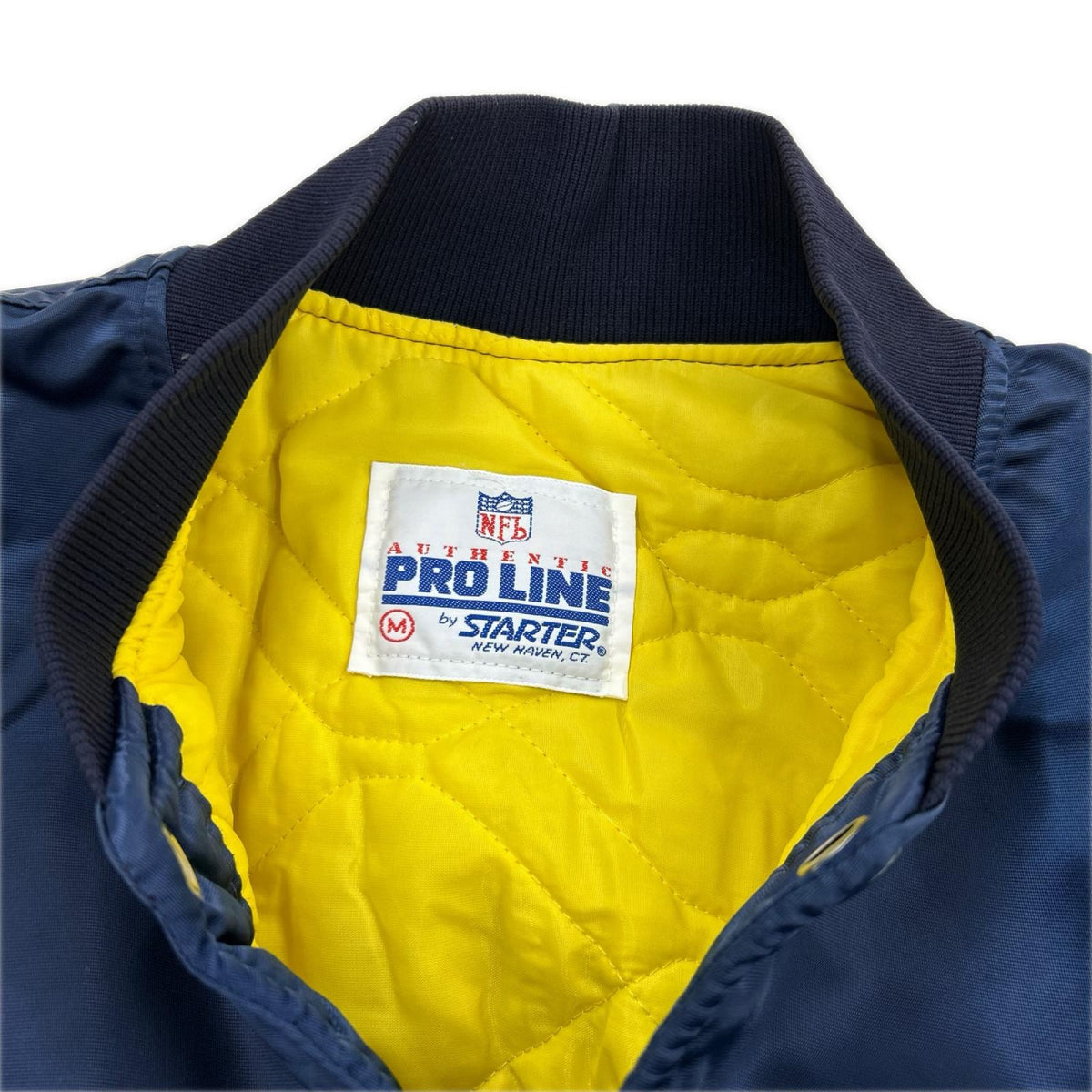 ジャケット 90s PRO LINE USA製　NFL ｽﾀｼﾞｬﾝ（M) M ネイビー