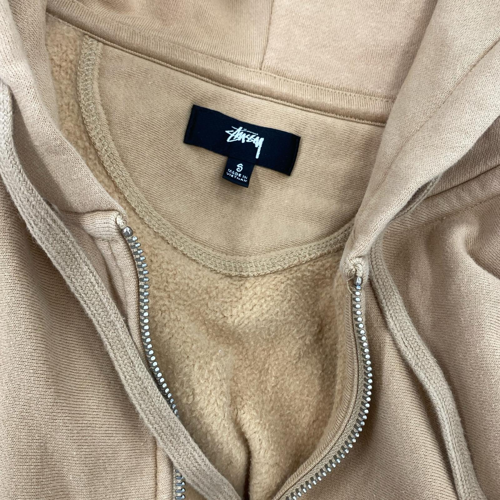 パーカー STUSSY パーカー（ジップアップ） S ベージュ