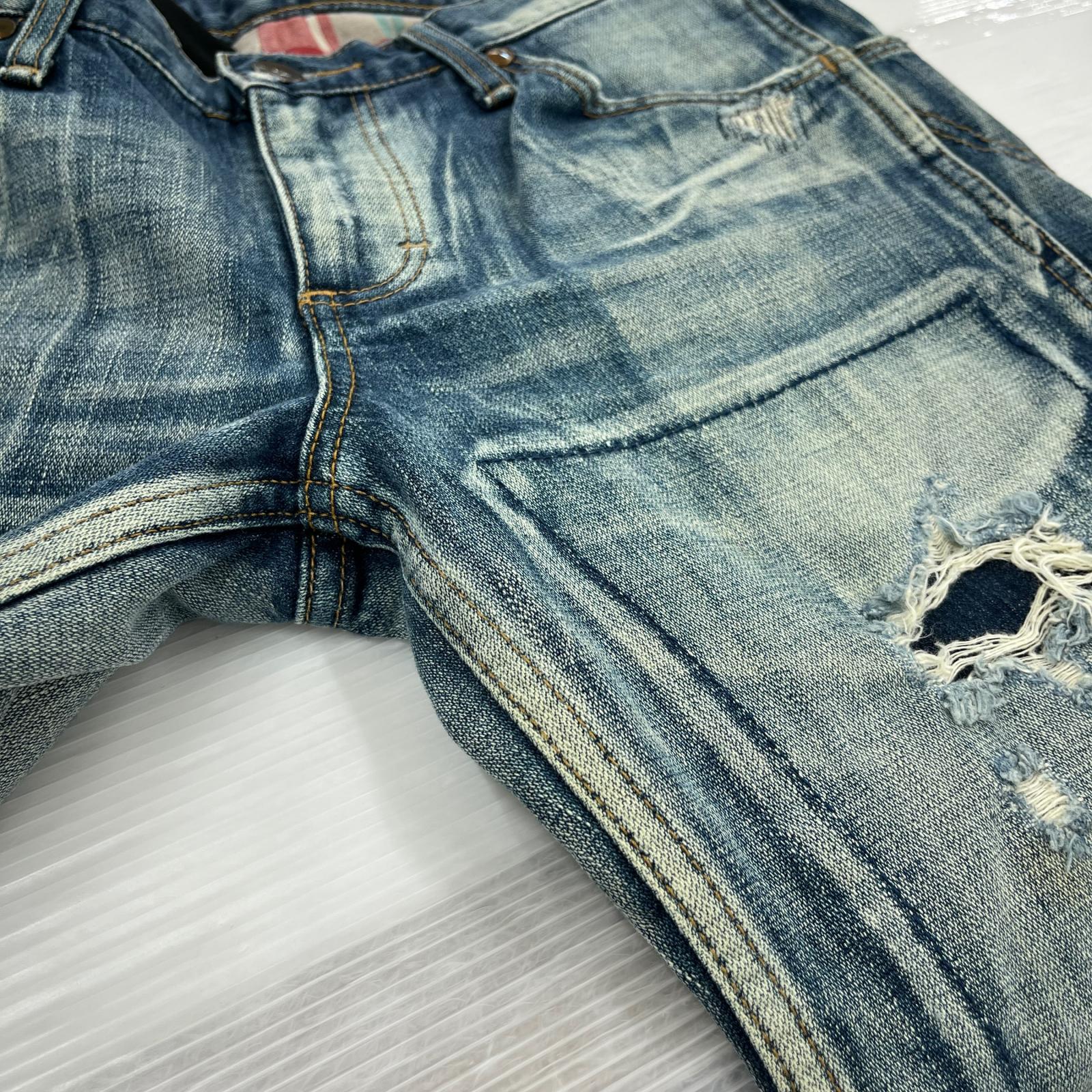 デニムパンツ × Wrangler フレア リペア S