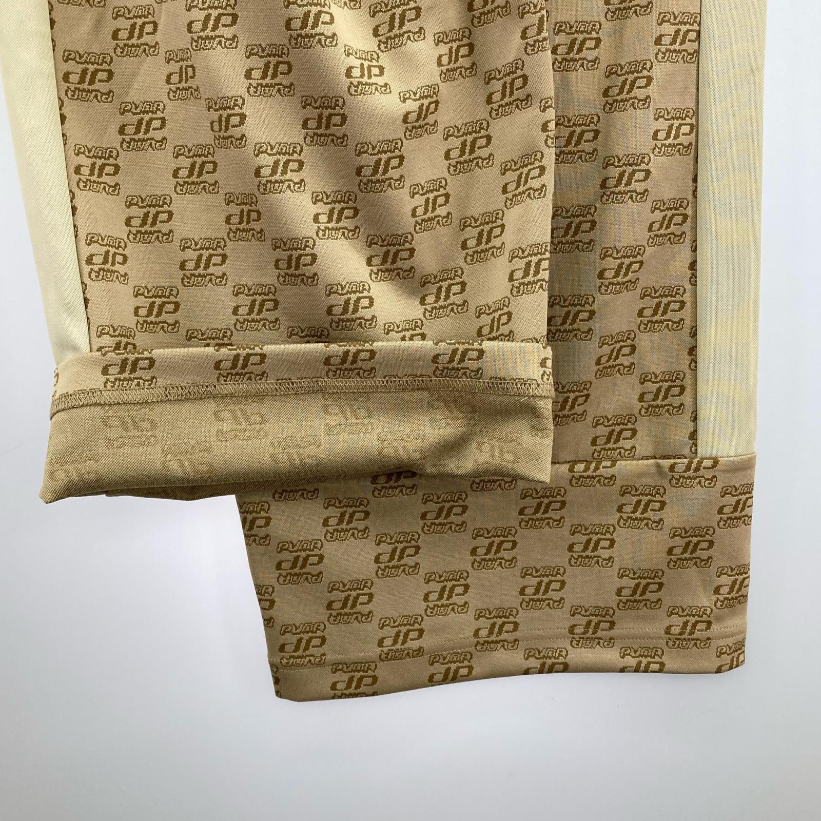 ジャケット PUMA CORE HERITAGE ｼﾞｬｶﾞｰﾄﾞ ｾｯﾄｱｯﾌﾟ L ベージュ