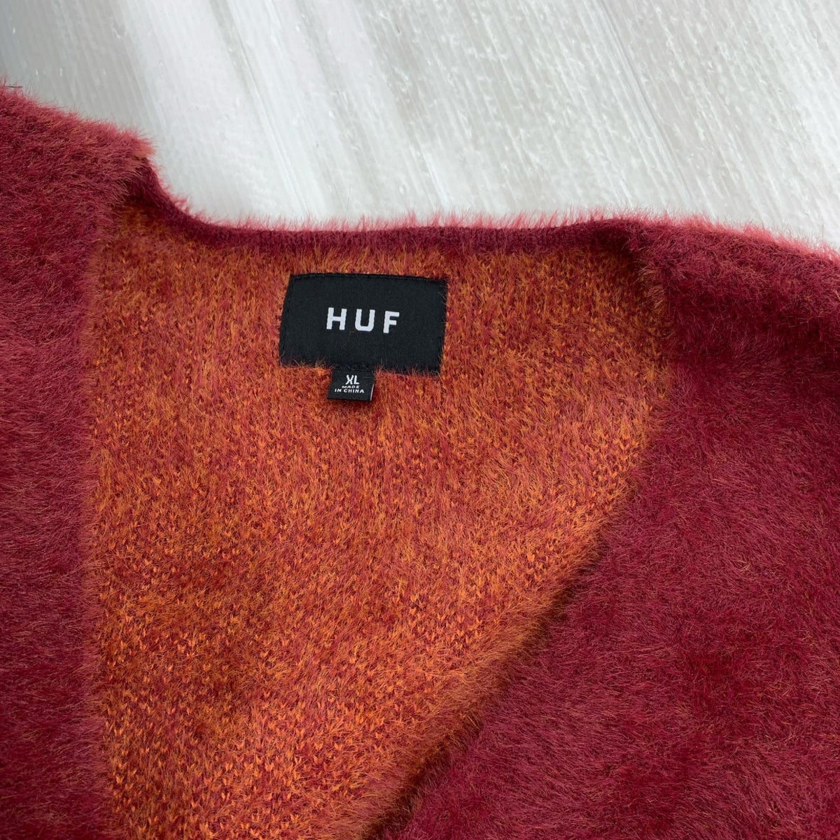 カーディガン MERGED CARDIGAN ｼﾞｬｶﾞｰﾄﾞ 2ﾄｰﾝ 赤/ｵﾚﾝｼﾞ