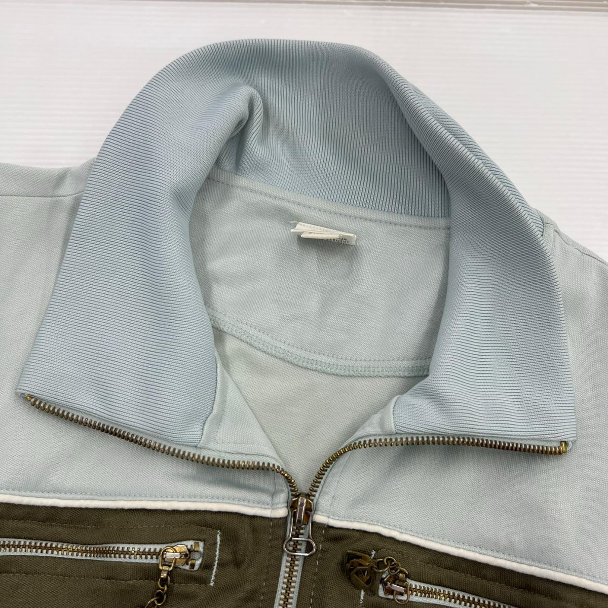 ジャケット ﾄﾗｯｸｼﾞｬｹｯﾄ ｼﾞｯﾌﾟﾎﾟｹｯﾄ 水色 （L） L
