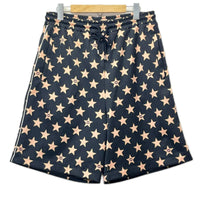 GUCCI/Technical jersey shorts with stars M 705299