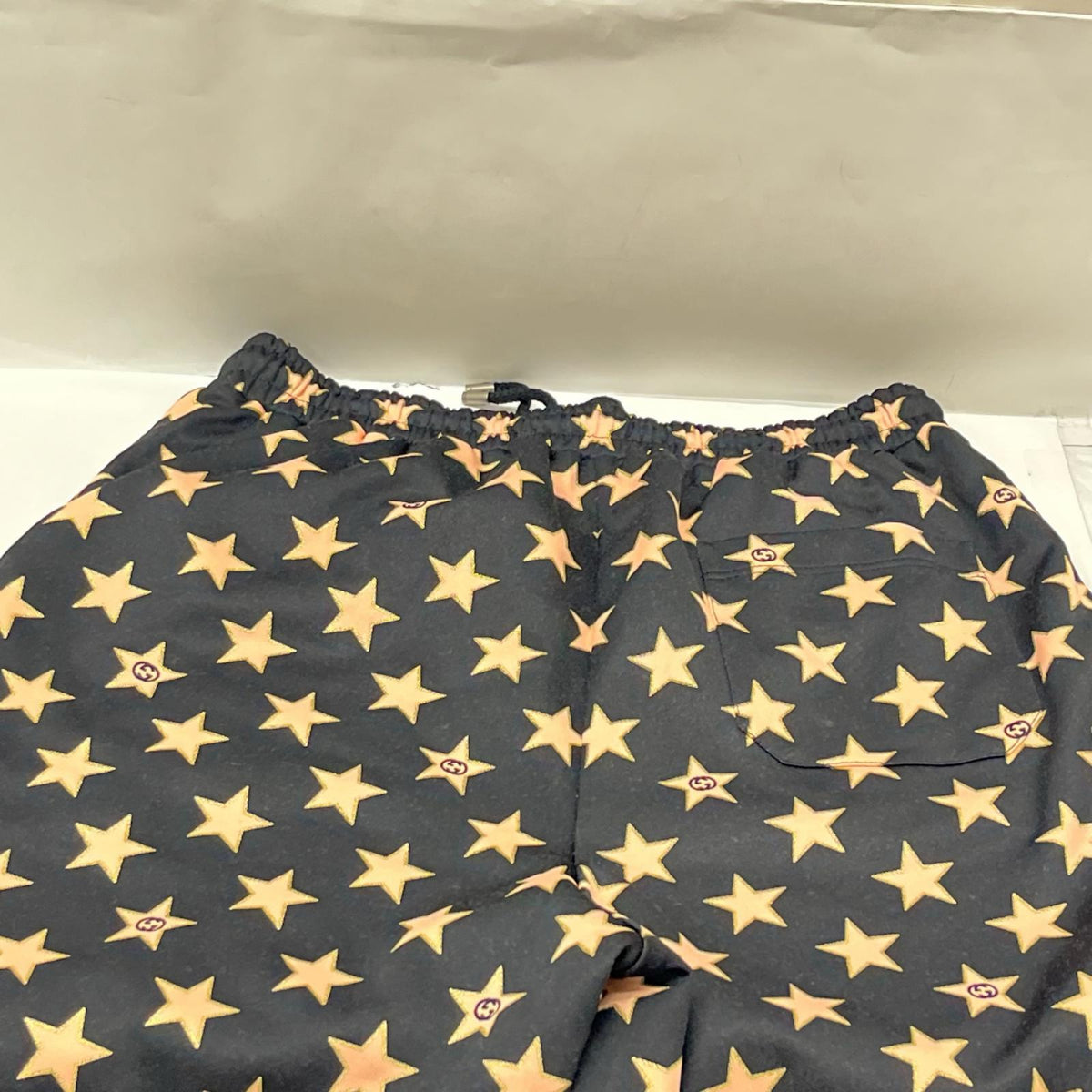 GUCCI/Technical jersey shorts with stars M 705299