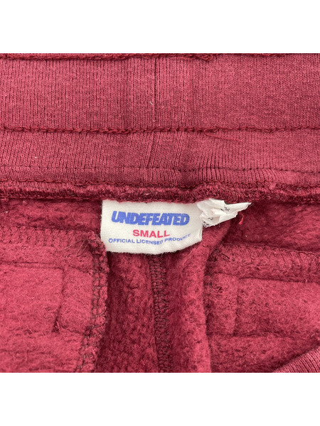 UNDEFEATED  スウェットパンツ エンジ (S)[値下]